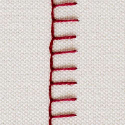 Buttonhole: with dark red thread on white background