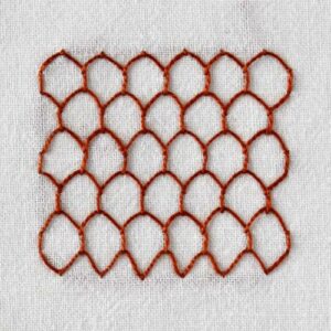 HoneycombStitchEmbroidery with dark red thread on white fabric