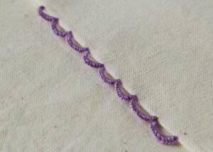 Buttonhole Bar Picots sampler stitched with purple pearl cotton thread image